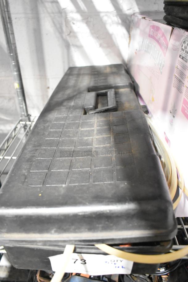 Tiered lot of various items including CDs, a unicorn tent, Jeep bag, and Westward power source in mixed condition.