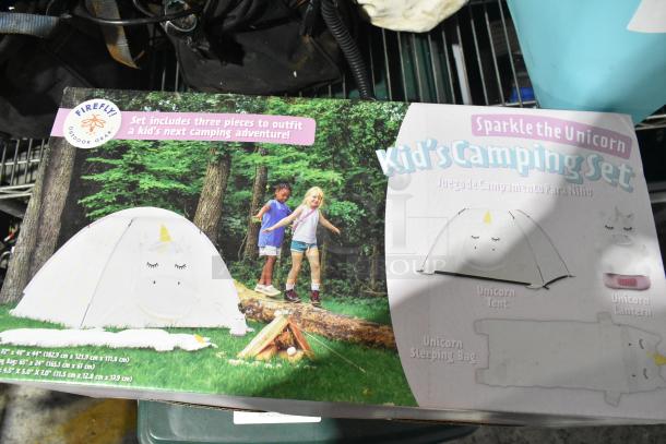 Firefly Kid's Camping Set box featuring a unicorn tent, unicorn sleeping bag, and unicorn lantern, in new condition.