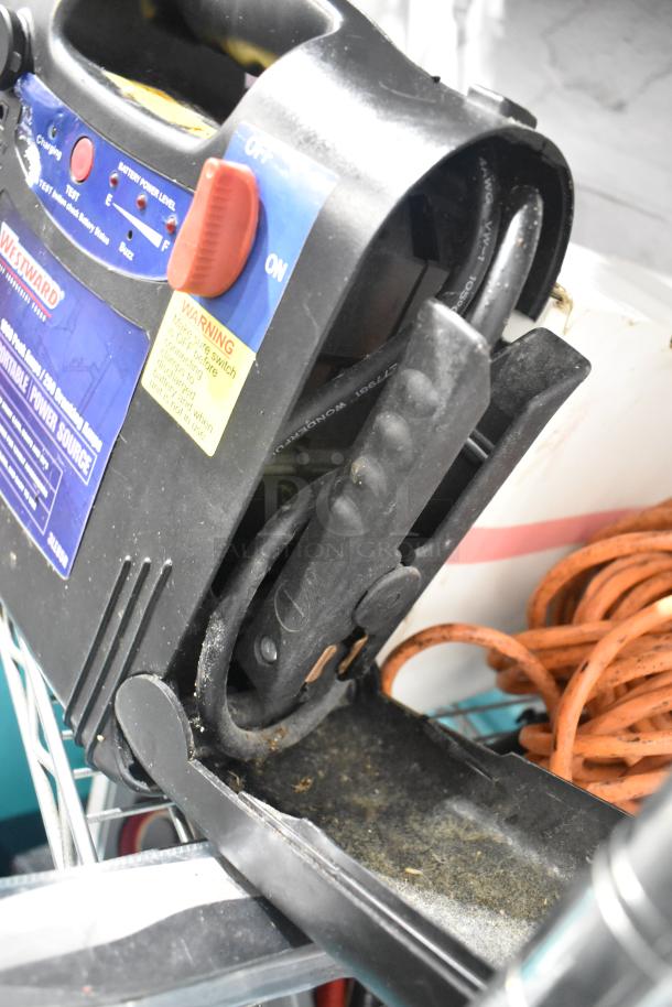 Westward portable power source, black with red switch, visible labels, in used condition, part of tier lot auction.