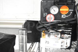 Jensen radio and air compressor, wires coiled, in good condition. Auction lot number 75 visible on tag.