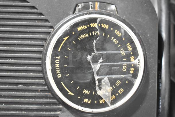Jensen radio with tuning dial, visible damage, AM/FM markings, in used condition. Auction includes two items.