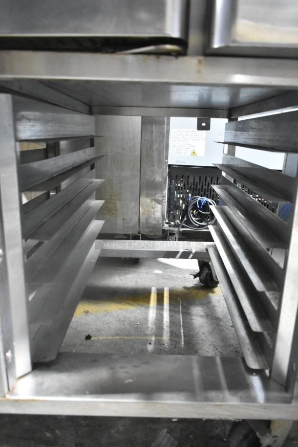 Baxter OV310E stainless steel commercial electric rotating rack oven on double pan rack, interior view, good condition.