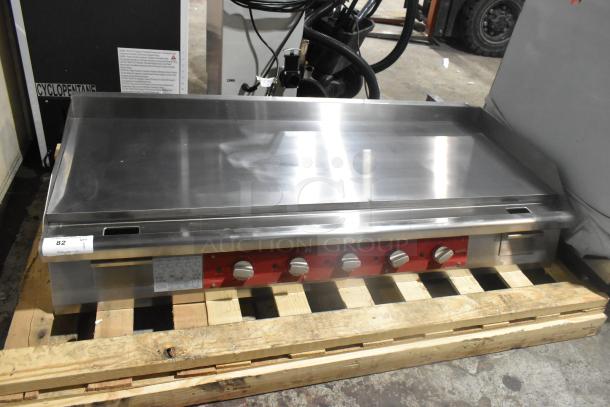 Brand new Avantco stainless steel commercial flat top griddle with thermostatic controls, minor scratches, on pallet.