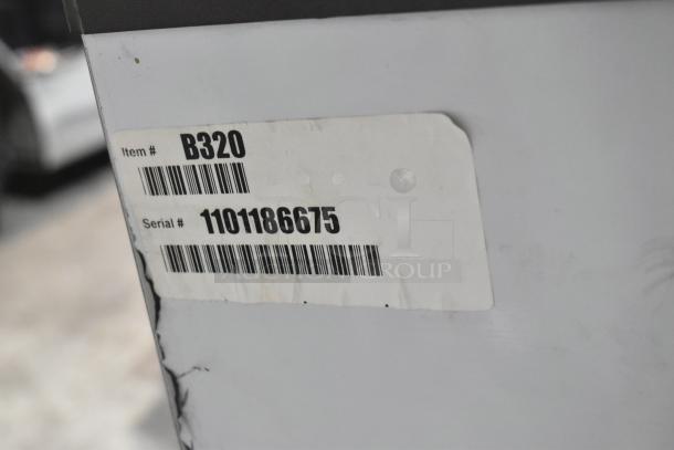 Manitowoc B320 stainless steel ice bin, new scratch and dent condition, showing label with model B320 and serial 1101186675.