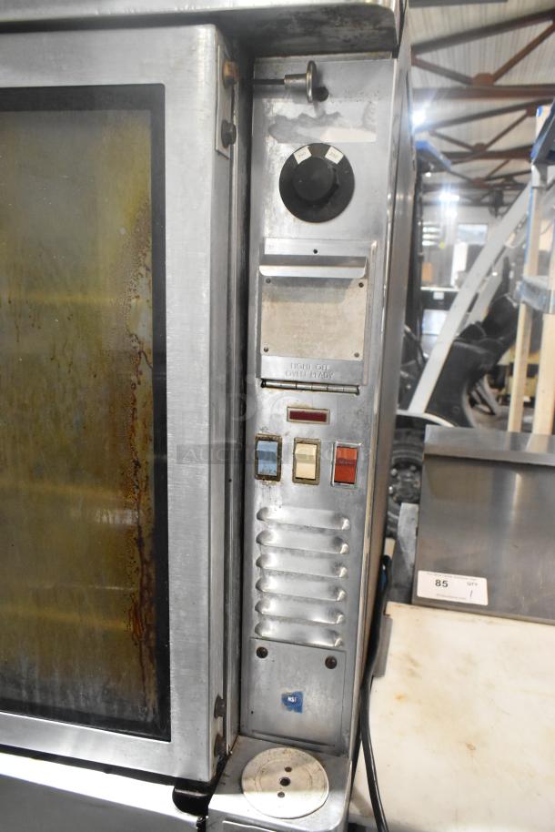 Blodgett stainless steel full-size commercial convection oven with view-through doors, metal racks, and thermostatic controls.
