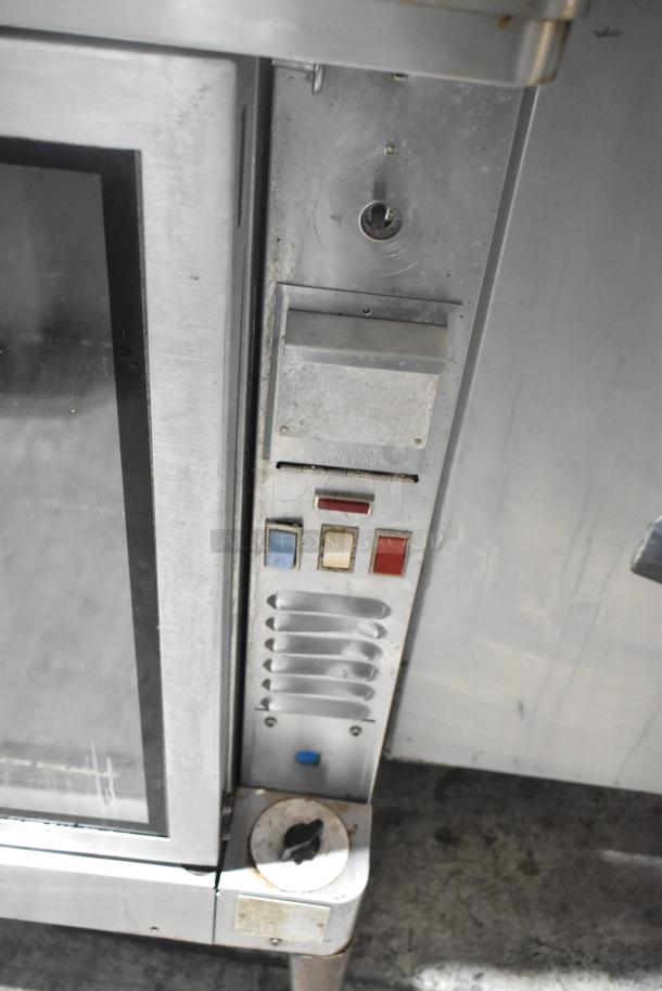 Blodgett stainless steel commercial convection oven with view-through doors, metal racks, and thermostatic controls.