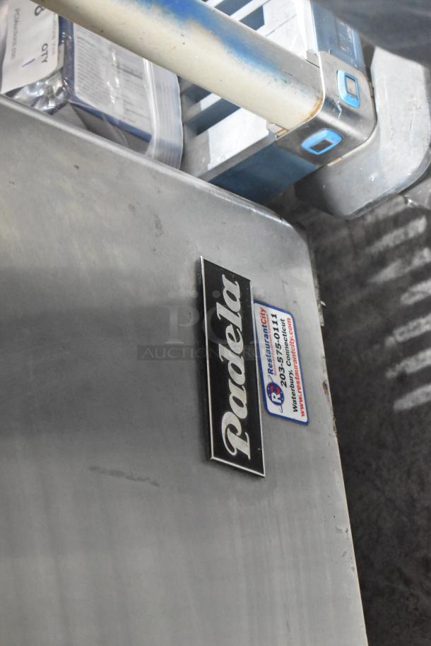 2020 Padela PDS-48-HC stainless steel prep table on casters, visible brand label and contact info sticker.