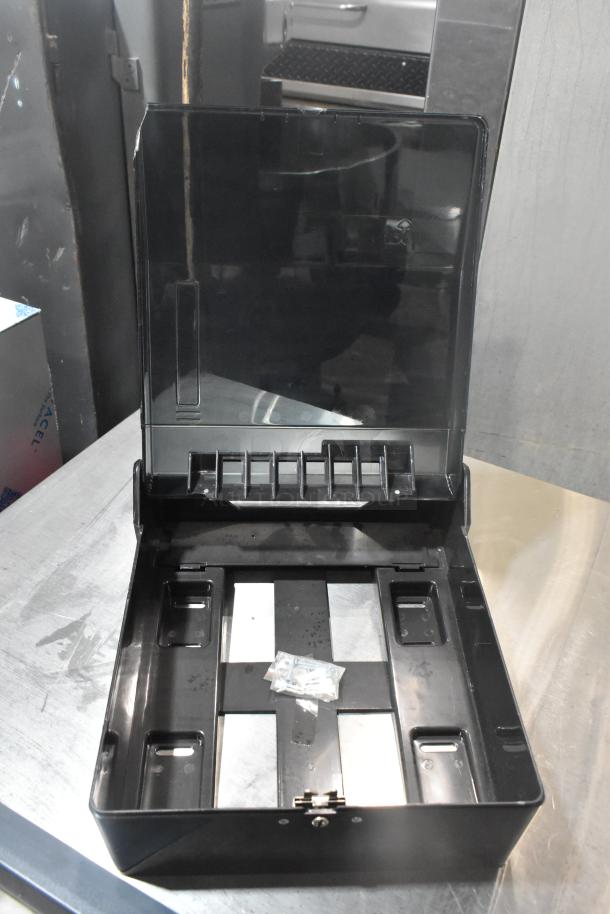 2 Update TD-MFOLD black poly wall mount paper towel dispenser, open, showing interior. New condition.