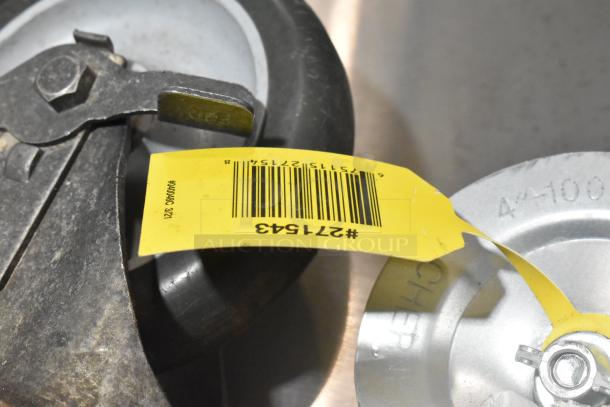 Lot includes 4 casters and vacuum brush. Visible yellow tag with barcode #271543. Wheel close-up shows metal hardware.