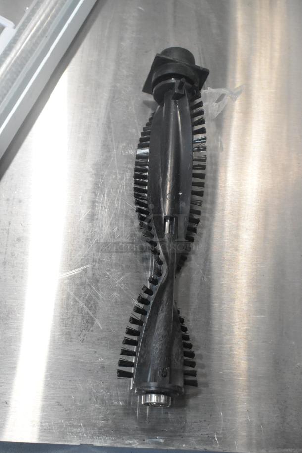 Vacuum brush with bristles, black plastic, reflective surface, good condition. Part of a lot with 4 casters.