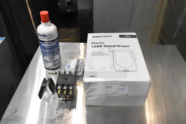 Advantage Supplies 158ADVHDB Plastic Hand Dryer box, Manitowoc K0039 Cartridge, GDP603 Standard Fuel Pump, and parts on table.