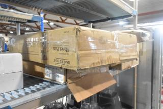 Cardboard box containing scratch and dent items, including Brand New Slate 14"x18" Trays and Bakers Lane Sheet Pans.