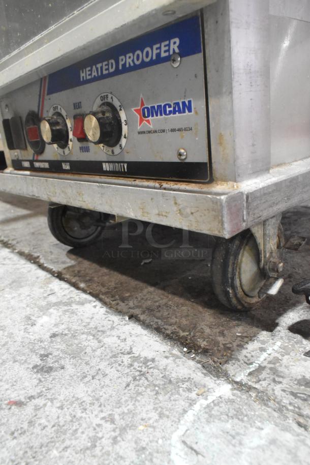 Omcan Metal Heated Holding Cabinet on casters, 115V, 1-phase. Features control panel with heat and humidity settings.