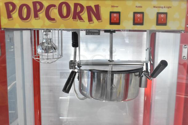 Carnival King 382PM30R red popcorn machine; new scratch & dent; 8 oz capacity, 120V; features include stirrer, kettle, and warming light.