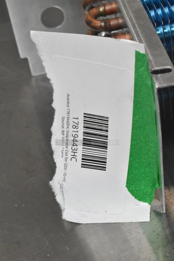"Brand new scratch and dent Avantco 17819443HC evaporator coil for GDC-10-HC, barcode and label visible, slight damage."