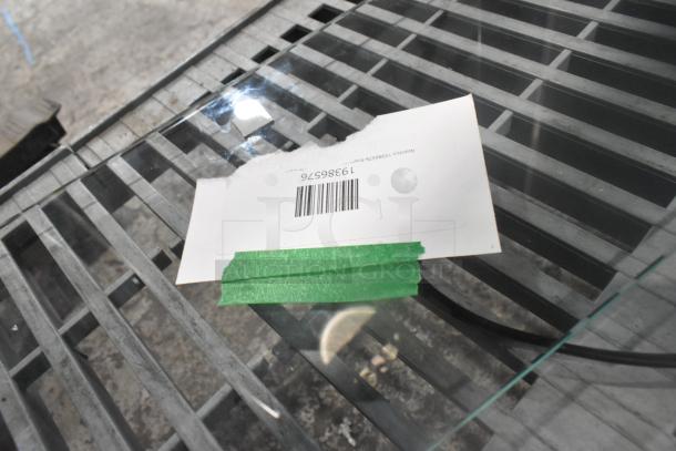 4 brand new scratch and dent items, including Avantco 19386576 glass panel with label, taped with green tape.