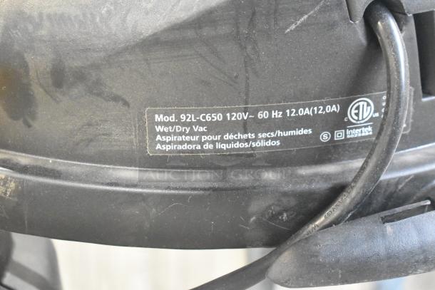Shop Vac 92L-C650 Wet/Dry Vac, 120V, 1 Phase, brand new with minor scratches. Label shows model and voltage details.