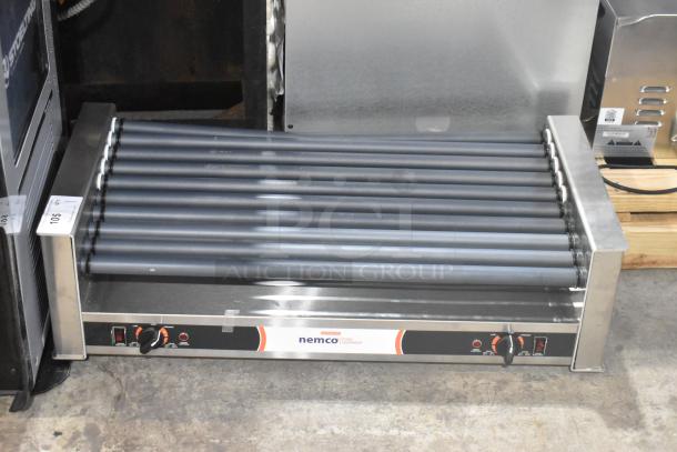 Brand new Nemco 8045SXW-SLT slanted hot dog roller grill, 45-capacity, non-stick coating, 120V, 1 phase, slight scratches.