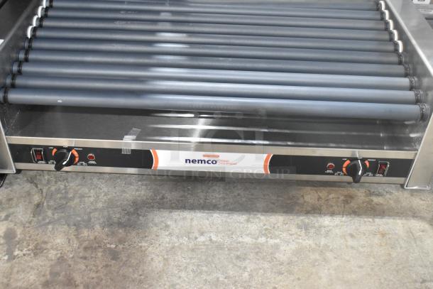 Brand new Nemco 8045SXW-SLT hot dog roller grill, 45 capacity, non-stick coating, 120V, wide slanted design, minor scratches.