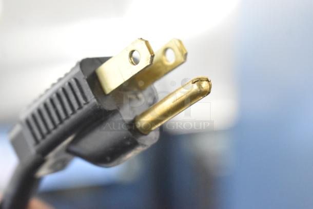 Close-up of an electrical plug for the Jun-Air 87R-4MN1-HSBHH Nitro Brew Nitrogen Generator.