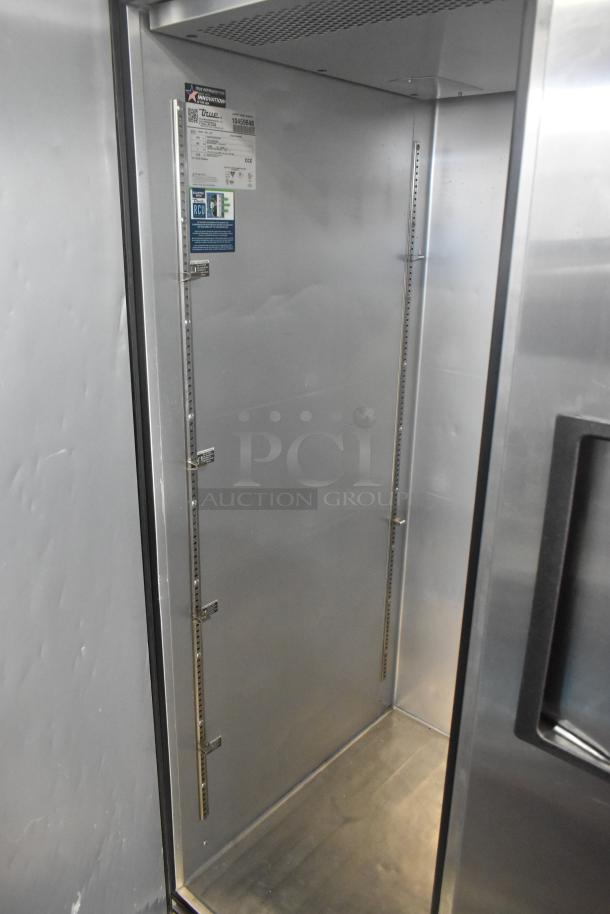 2022 True TG2R-2S-HC stainless steel commercial cooler, 2-door, 115V, 1 phase, interior view, ventilation and shelving visible.