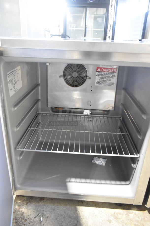 2020 Delfield 406P-STAR2 stainless steel undercounter cooler, single door, commercial casters, labels indicating 115V, 1-phase.