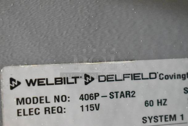 2020 Delfield 406P-STAR2 stainless steel undercounter cooler label, shows "115V," model, and make details.