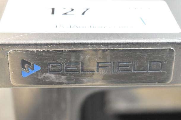 Delfield 406P-STAR4 stainless steel undercounter cooler, single door, on commercial casters. Visible Delfield logo plate.