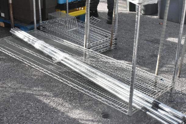 Chrome finish 3-tier shelving unit with included shelving poles wrapped for stability. Buyer must dismantle.