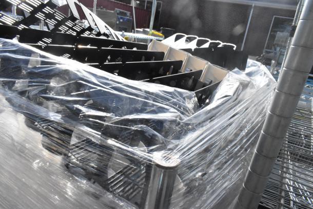 Chrome finish 3-tier shelving unit with contents and shelving poles, wrapped in plastic. Buyer must dismantle.