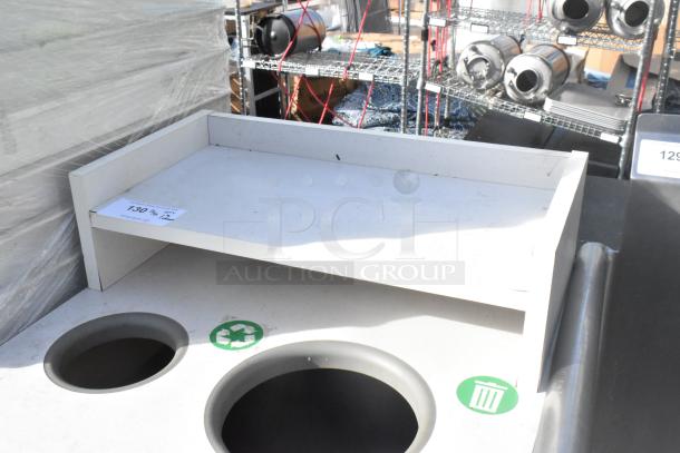 Trash can shell with deposit holes, tray slide, and door. Shows recycle and trash icons. Light wear visible.