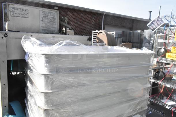 21 white poly dough bins stacked, wrapped in plastic, in good condition. Auction includes 21 times your bid.
