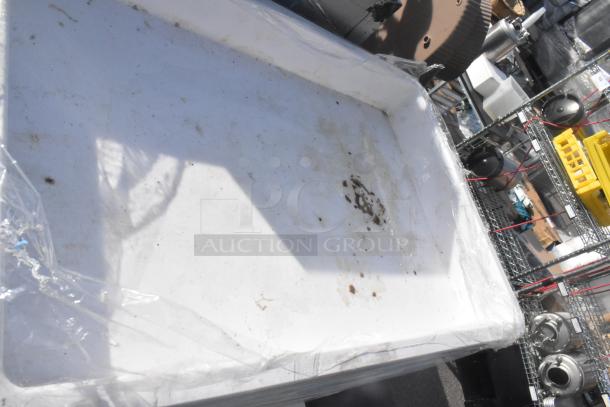 White poly dough bin, slightly soiled, stackable design, used condition, part of a lot of 21 for auction.