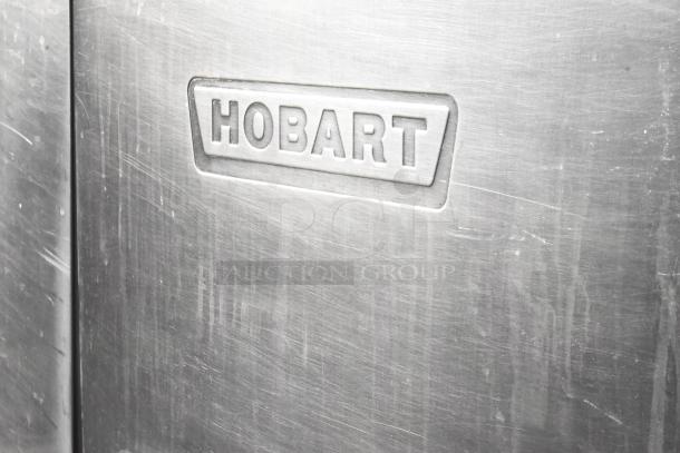 Hobart C44A stainless steel conveyor dishwasher, commercial floor style, 208V, 3 phase, logo visible, used condition.