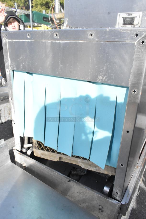 Hobart C44A stainless steel conveyor dishwasher, 208V, 3-phase, shows minor wear, with front blue flaps and timer control.