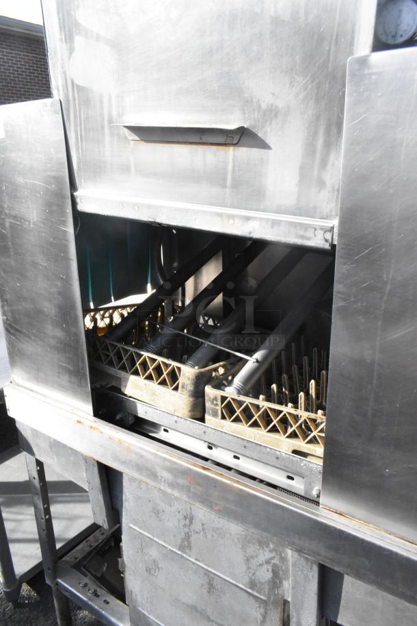 Hobart C44A stainless steel commercial conveyor dishwasher, visible interior racks, used condition, 208V, 3 phase.