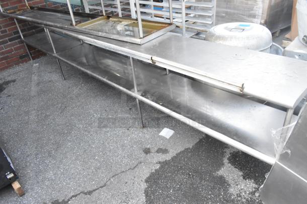 Three stainless steel over shelves in fair condition, featuring sturdy construction and spacious surface, ideal for kitchen use.