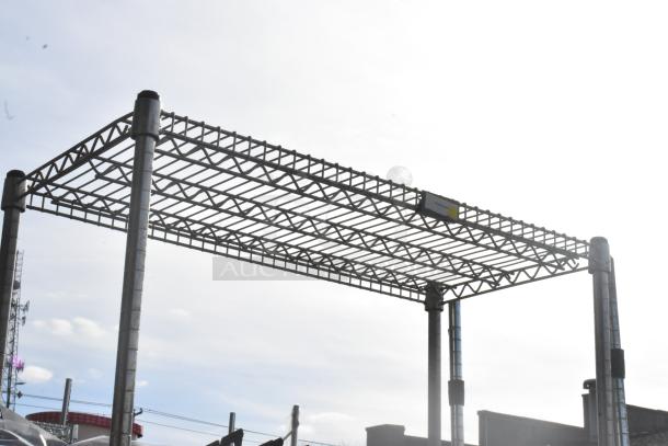 Chrome finish 2-tier wire shelving unit, sturdy construction, dismantling required, ideal for storage or display.