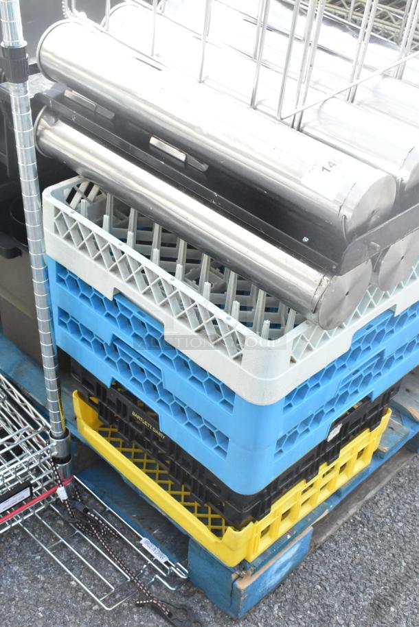 Pallet with dish caddies, cup dispenser dolly, metal rack. Includes blue, yellow caddies, stainless steel dispensers. Tag 140 visible.