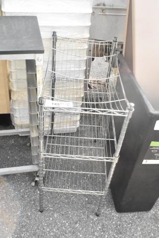 Chrome finish 3-tier wire shelving unit in good condition. Includes disassembly requirement. Visible label reads "143 LOT 107."