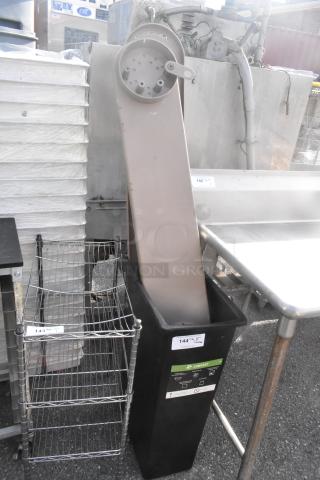 Black Poly Slim Jim Trash Can with contents, used condition. Compost label visible. Includes attached pieces.