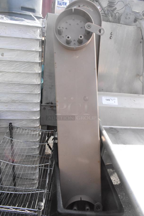 Black poly Slim Jim trash can filled with items, condition appears used. Auction tag visible with lot number.