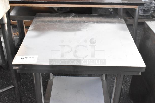 Stainless steel table with metal under shelf, showing minor wear. Auction tag indicates item 146, 1 available.