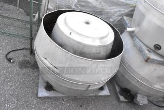 ILG metal commercial rooftop mushroom exhaust fan, 115/208 volts, 1 phase, shows signs of wear, sits on concrete base.