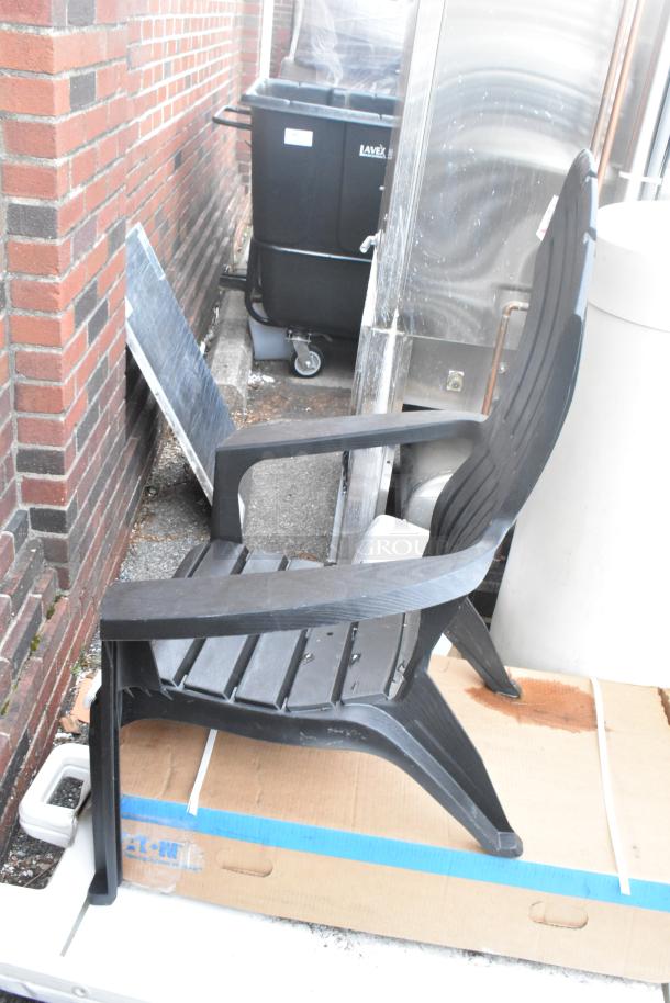Black patio chair on cardboard, minor scratches visible. Near Ecolab HDCARE Conic Bag Dispenser and Eaton SCB1457009 box.