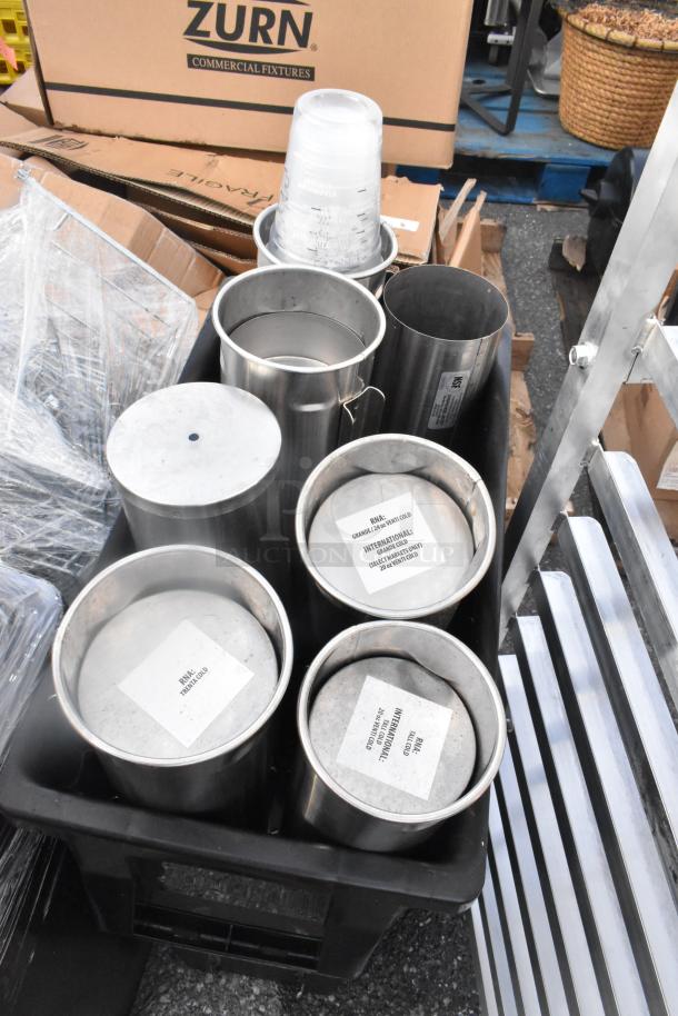 Lot of 3 black Slim Jim trash cans with cup dispensers. Visible labels show "RIN: TRAIN GOLD" and "INTERNATIONAL: 28 RIN (28 ITEMS)".