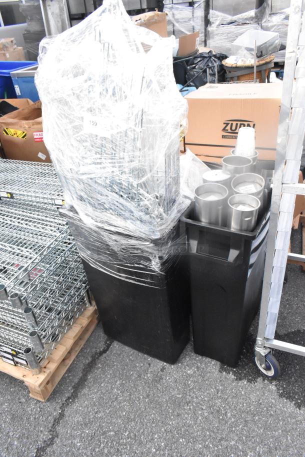 Lot of 3 black poly Slim Jim trash cans with contents, including cup dispensers, wrapped in plastic; appears unused.