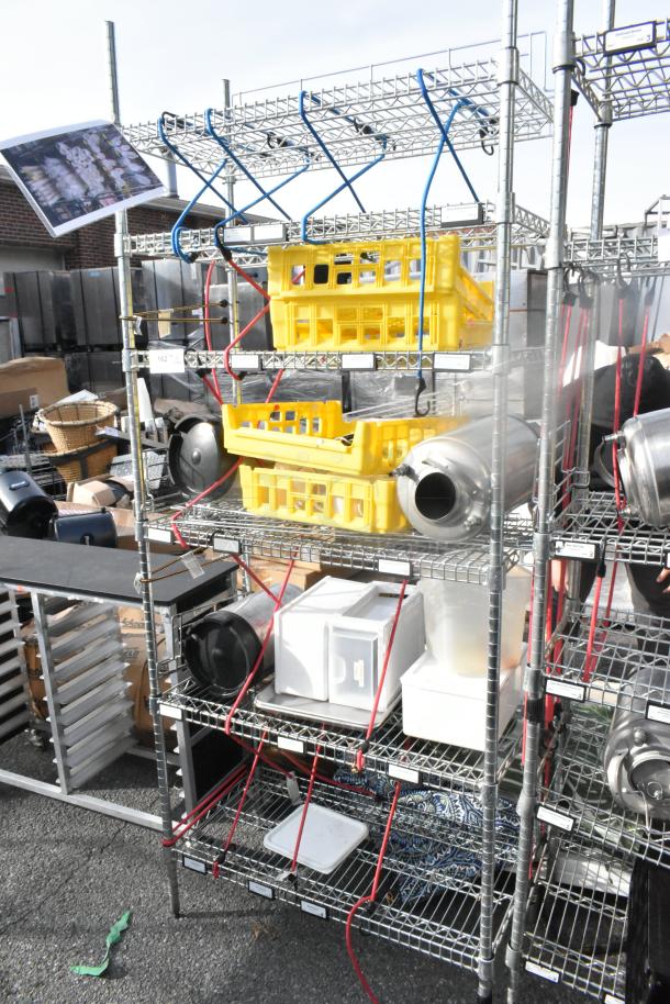 Chrome finish 6-tier wire shelving unit with assorted poly bins and contents. Buyer must dismantle. Consider freight charges.