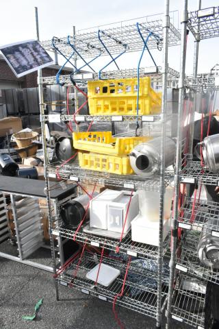 Chrome finish 6-tier wire shelving unit with assorted poly bins and contents. Buyer must dismantle. Consider freight charges.