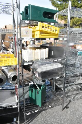 Chrome finish 5-tier wire shelving unit with various containers including a poly beverage holder dispenser. Buyer dismantles.